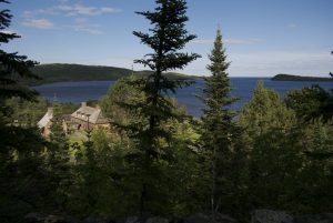 photograph of the Grand Portage historic post from Mount Rose looking over the post into Lake Superior.