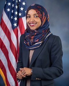 Rep. Ilhan Omar (D-MN05) pictured in front of a United States flag. Official Congressional photogrtaph