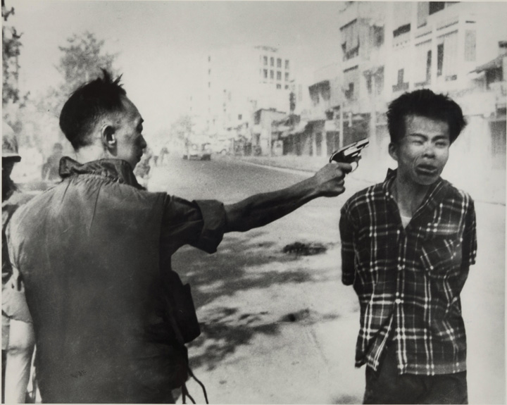 The director of South Vietnam's national police force executes a bound Viet Cong prisoner