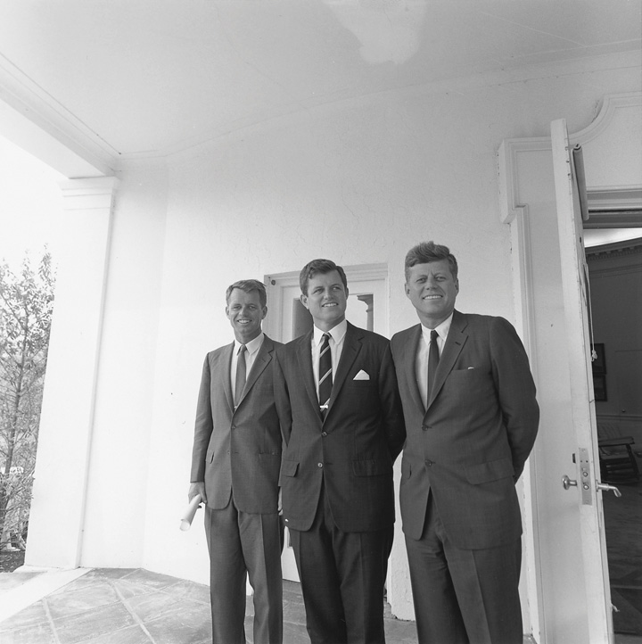 The Kennedy brothers standing side by side at the White House