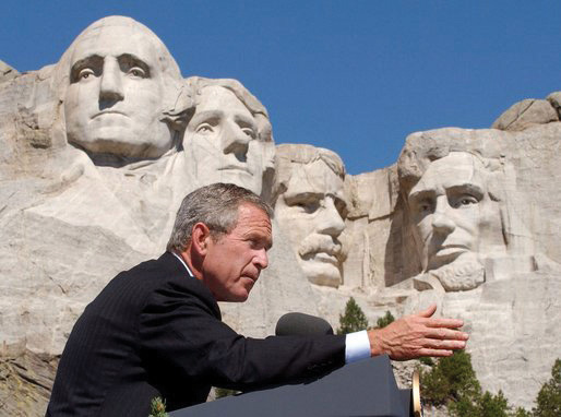 President George W. Bush speaking in front of Mt. Rushmore