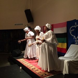 Swearing-in ceremony of the first ever GwètòDe's for the Haitian diaspora by Konfederasyon Nasyonal Vodouyizan Ayisyen (KNVA) held 2/25/2017 at National Black Theatre in Harlem NYC. GwètòDe's are the clergy of Haitian Vodou, representing the interests of Haitian vodouyizan in a specific geographic region. In this ceremony GwètòDe's were sworn in for the state of New York (Manbo Florence Jean-Joseph, pictured center), the state of Massachusetts (pictured left) and for Canada (Manbo Fabiola Abelard, pictured right). KNVA is a Haiti-based organization that designates the Ati National, the head of Haitian Vodou and all of the vodou clergy, for certification by the Haitian government. The Haitian Constitution of 1987 gave Vodouyizan the same rights as practitioners of other faiths.