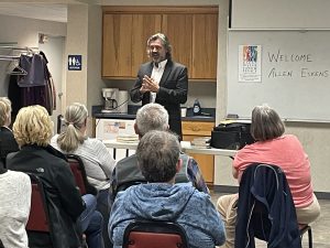 Author speaking to an audience