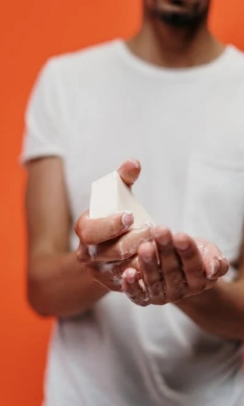 A person washing their hands