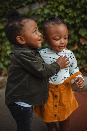 Two children holding each other