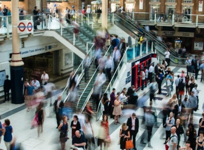 A group of people in a busy transit station