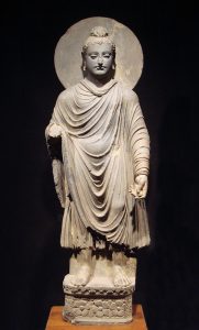 Gandhara Buddha. 1st-2nd century CE. Height is about 1 meter. Tokyo National Museum. Personal photograph by World Imaging (talk), 2004. Released in the Public Domain.