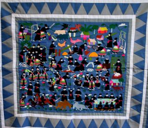 A Hmong embodied blue cloth telling a pictorial story