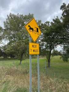 Amish cart next 7 miles sign