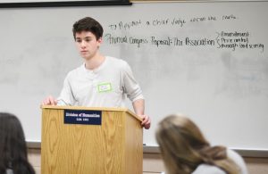 student at lectern