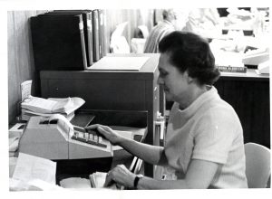 Betty Gustafson working at a computer.