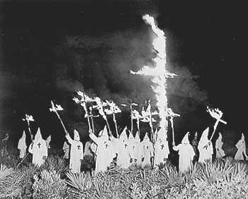 Klan night rally with burning crosses