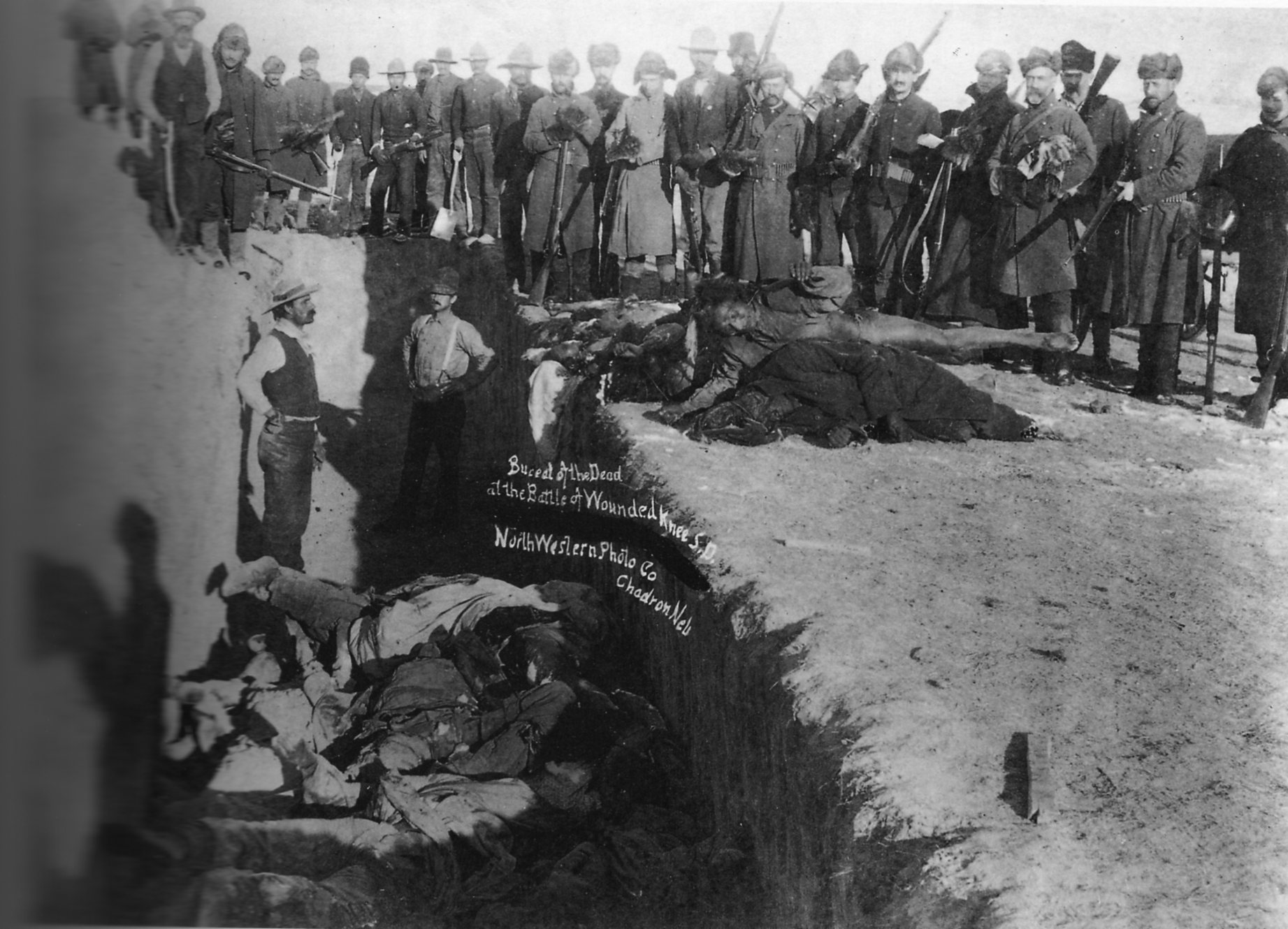 Burial of the dead after the massacre of Wounded Knee.