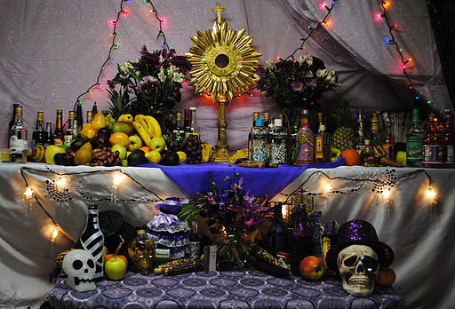 Haitian Vodou altar created during a festival for the Guede spirits, Boston, MA. Top right area is offerings to Rada spirits; top left to Petwo spirits; bottom to Gede.